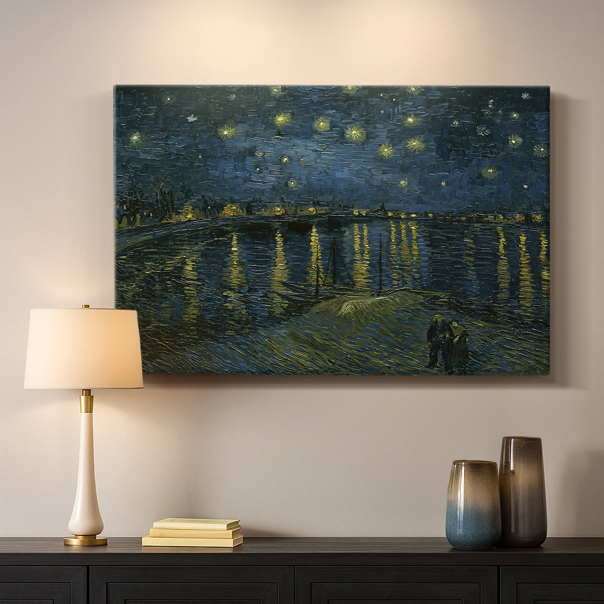 Canvas art print detailing a nocturnal landscape emphasizing contrast between lights and dark water, mounted in a softly lit interior space