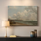 Canvas art print detailing a maritime landscape with shoreline, mounted in a softly lit interior space