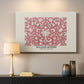 Canvas art print detailing a textile composition featuring symmetrical flower motifs, mounted in a softly lit interior space