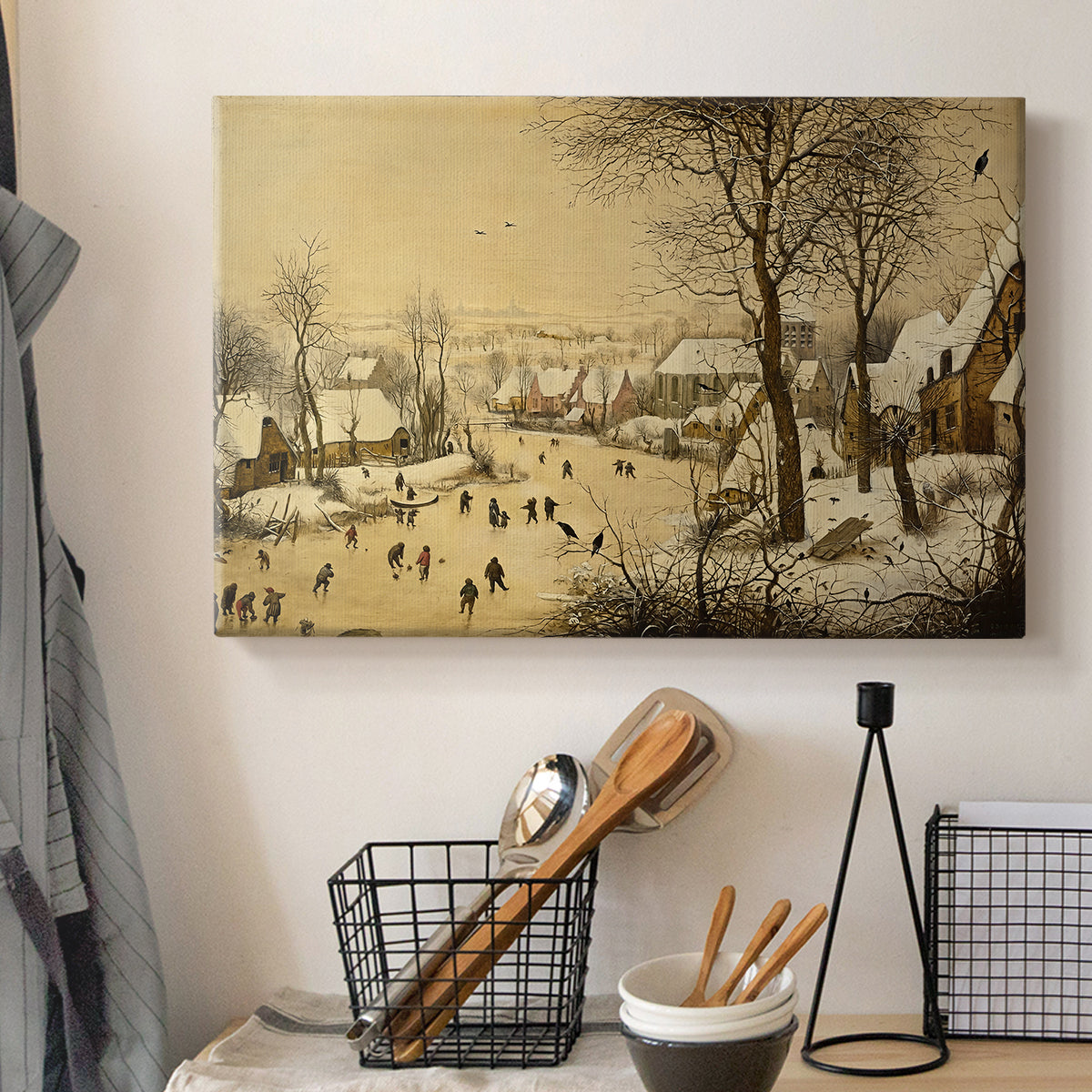 Canvas art print detailing a traditional winter activity scene, displayed in a softly lit workspace setting