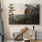 Canvas art print detailing a realistic countryside with geology, displayed in a softly lit workspace setting