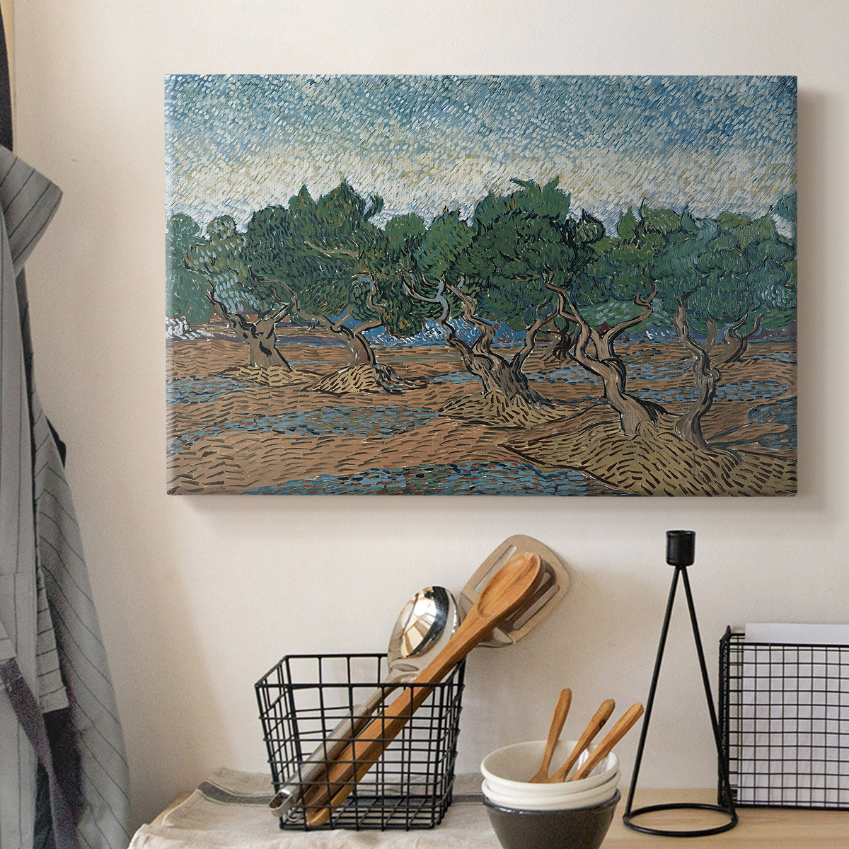 Canvas art print detailing a countryside composition with trees and dynamic color, displayed in a softly lit workspace setting