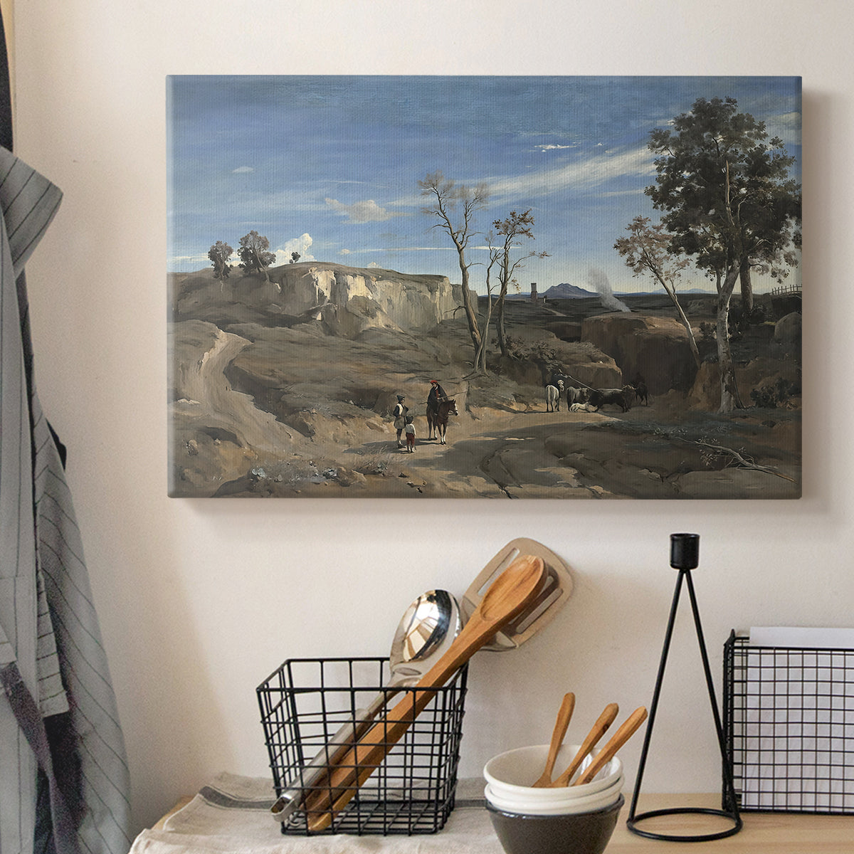 Canvas art print detailing a tranquil countryside scene with soft tonal depth, displayed in a softly lit workspace setting