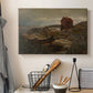 Canvas art print detailing a peaceful harbor setting with architecture and boats, displayed in a softly lit workspace setting