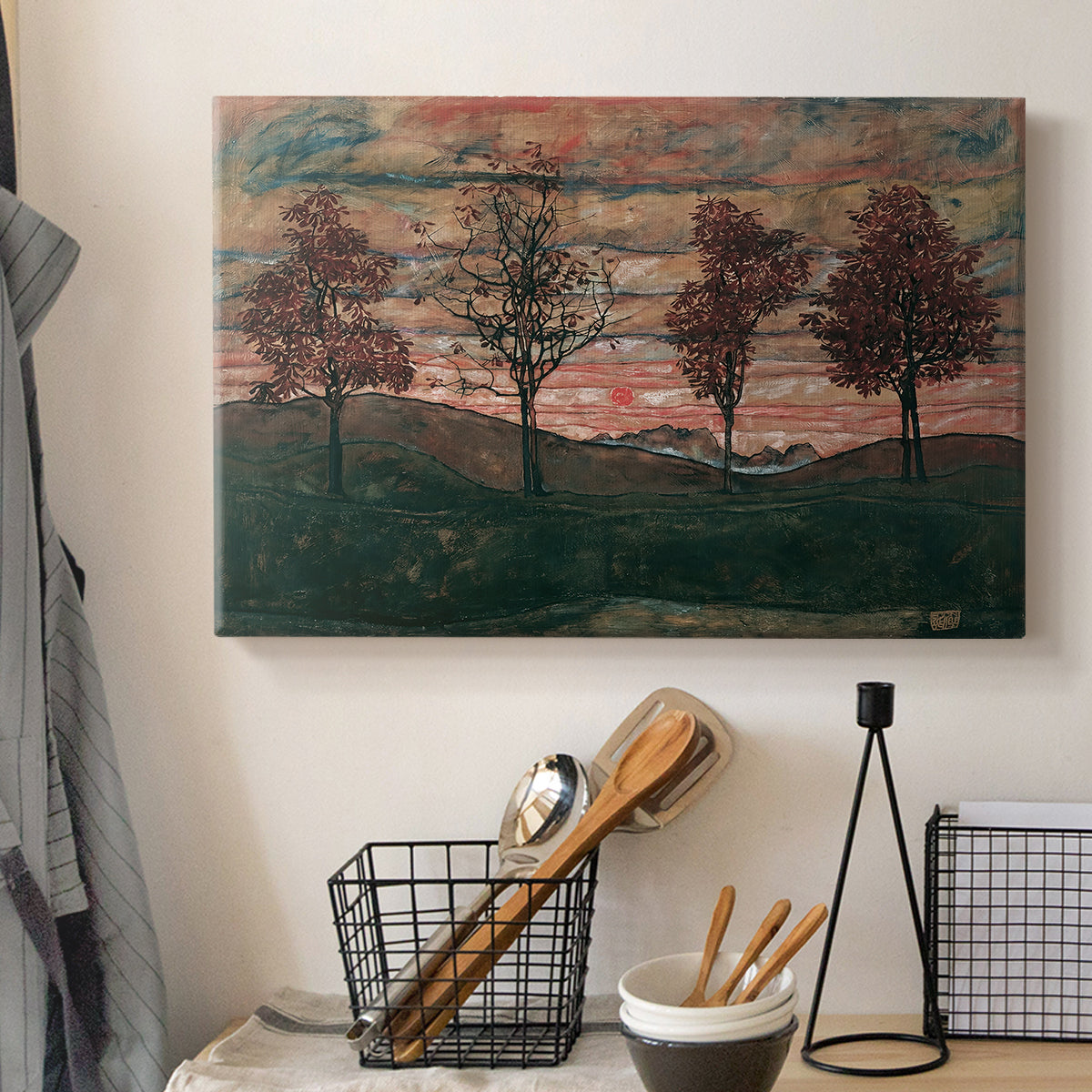 Canvas art print detailing an expressionist landscape featuring isolated trees in field, displayed in a softly lit workspace setting