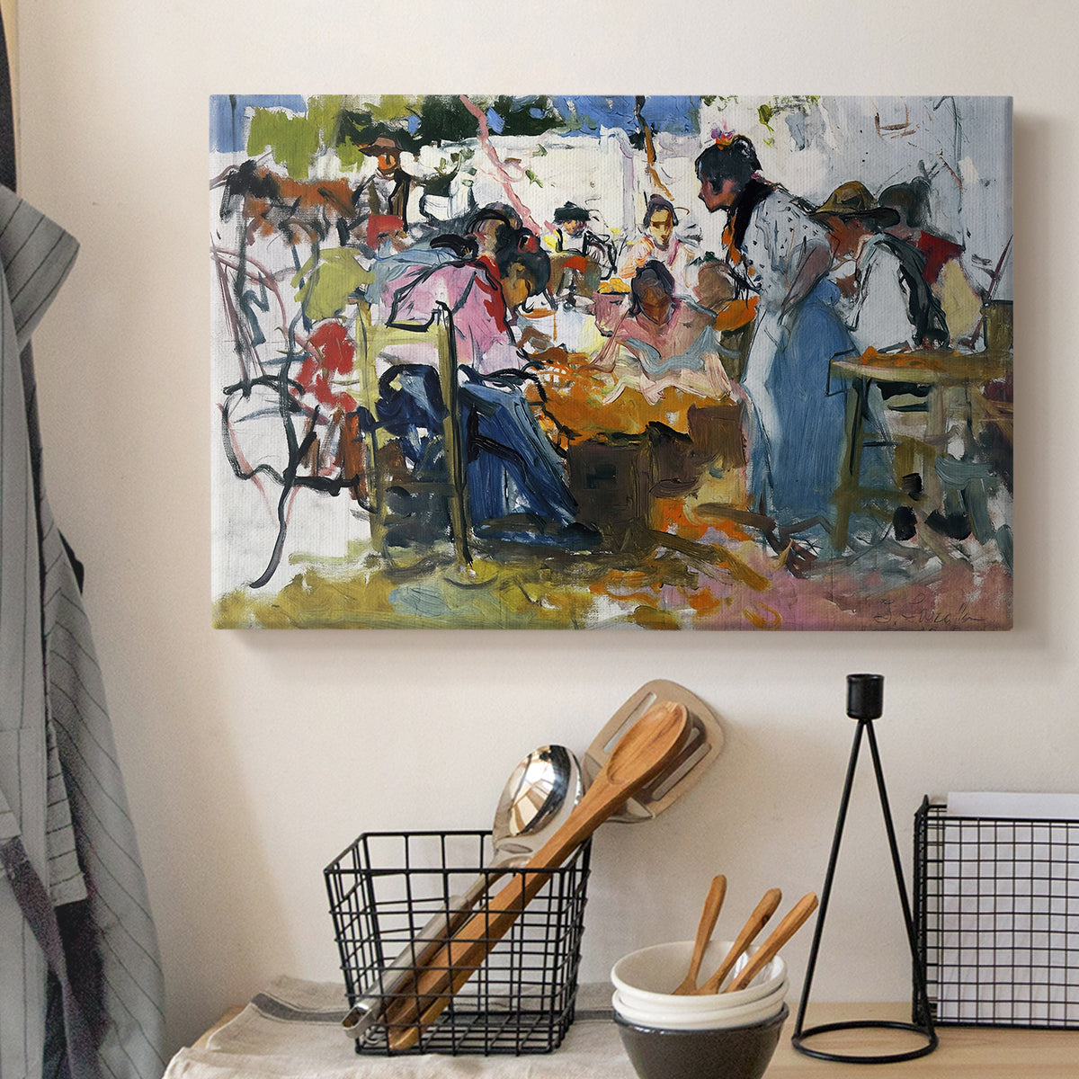 Canvas art print detailing an impressionist scene of people gathered around nets, displayed in a softly lit workspace setting