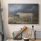 Canvas art print detailing a farm animal study in open landscape, displayed in a softly lit workspace setting