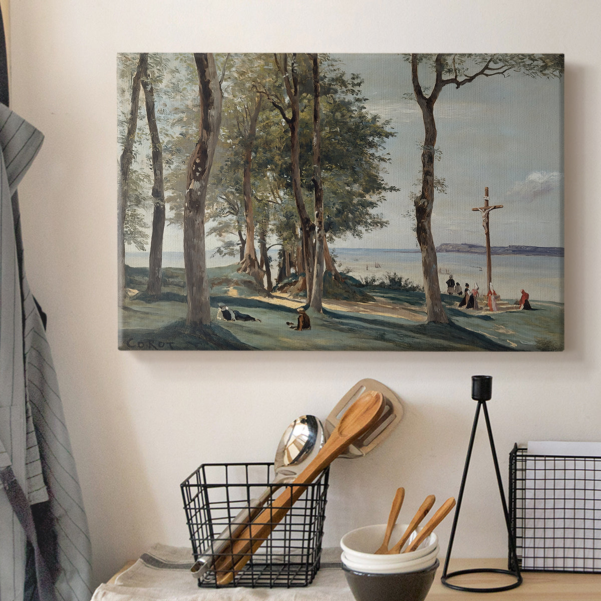 Canvas art print detailing a tranquil setting with cross and surrounding vegetation, displayed in a softly lit workspace setting