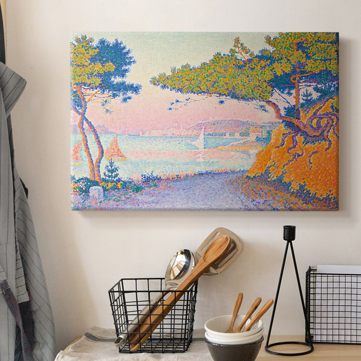 Canvas art print detailing a coastal composition with land and water in balance, displayed in a softly lit workspace setting