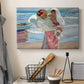 Canvas art print detailing an impressionist beach scene with soft movement and light, displayed in a softly lit workspace setting