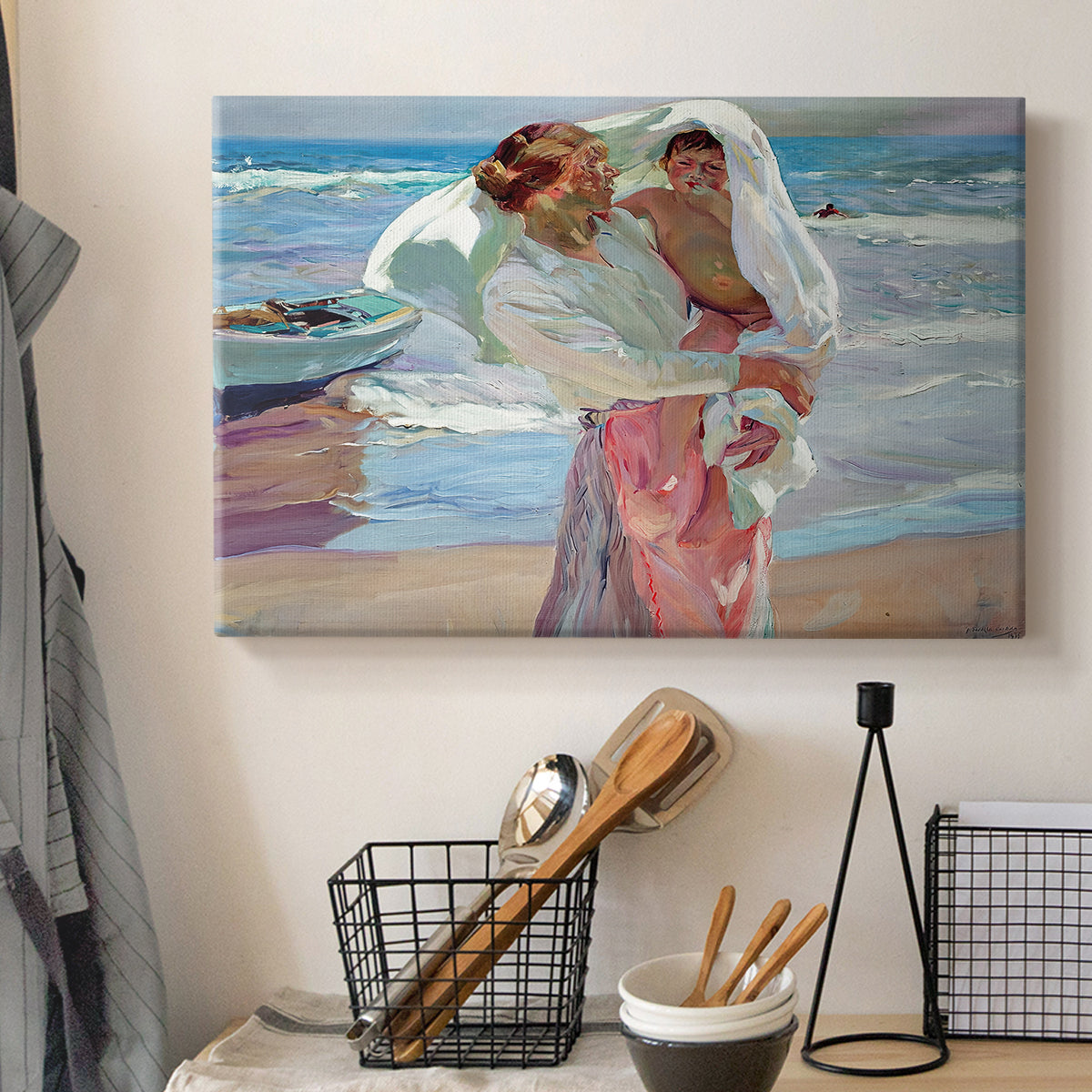 Canvas art print detailing an impressionist beach scene with soft movement and light, displayed in a softly lit workspace setting