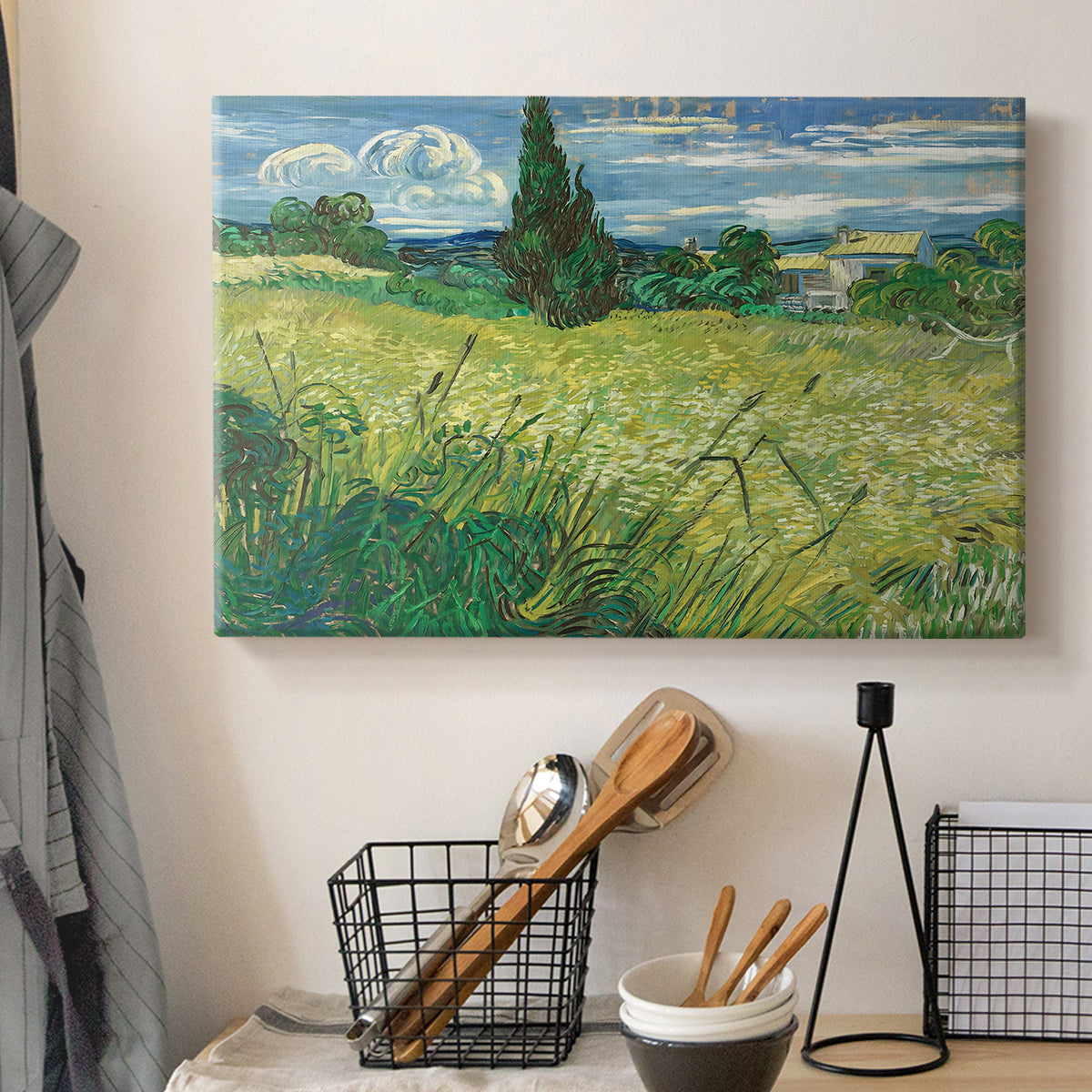 Canvas art print detailing a countryside composition with wheat and cypress, displayed in a softly lit workspace setting