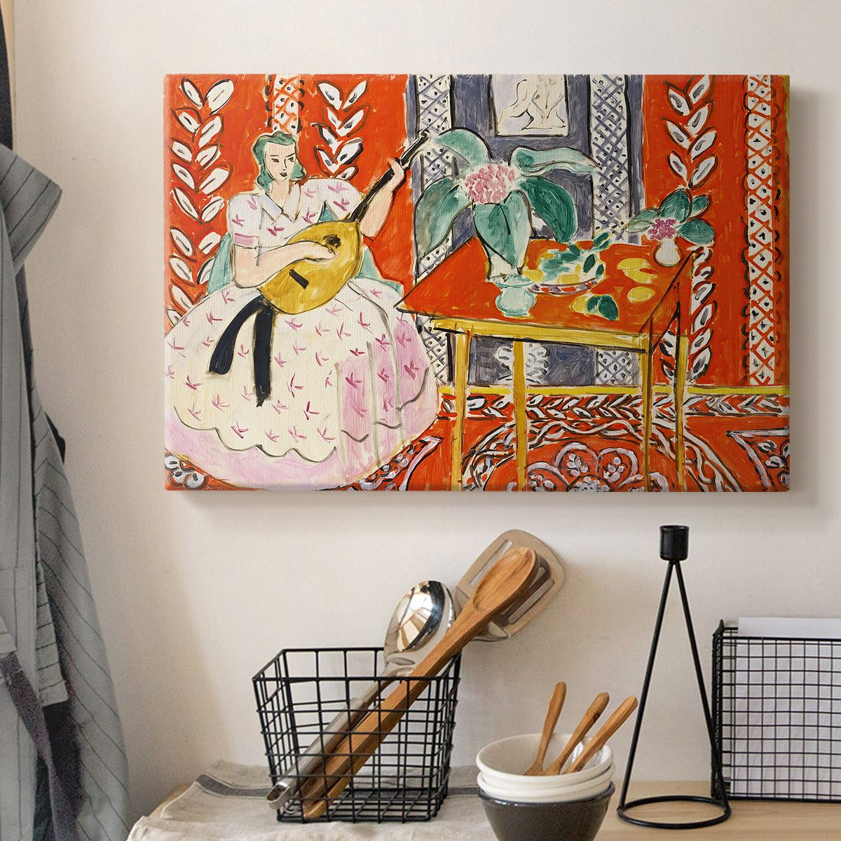 Canvas art print detailing a stylized figure with musical instrument, displayed in a softly lit workspace setting