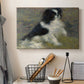 Canvas art print detailing an animal portrait of a dog in natural outdoor setting with soft light, displayed in a softly lit workspace setting
