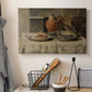 Canvas art print detailing a still life emphasizing texture and form of household items, displayed in a softly lit workspace setting