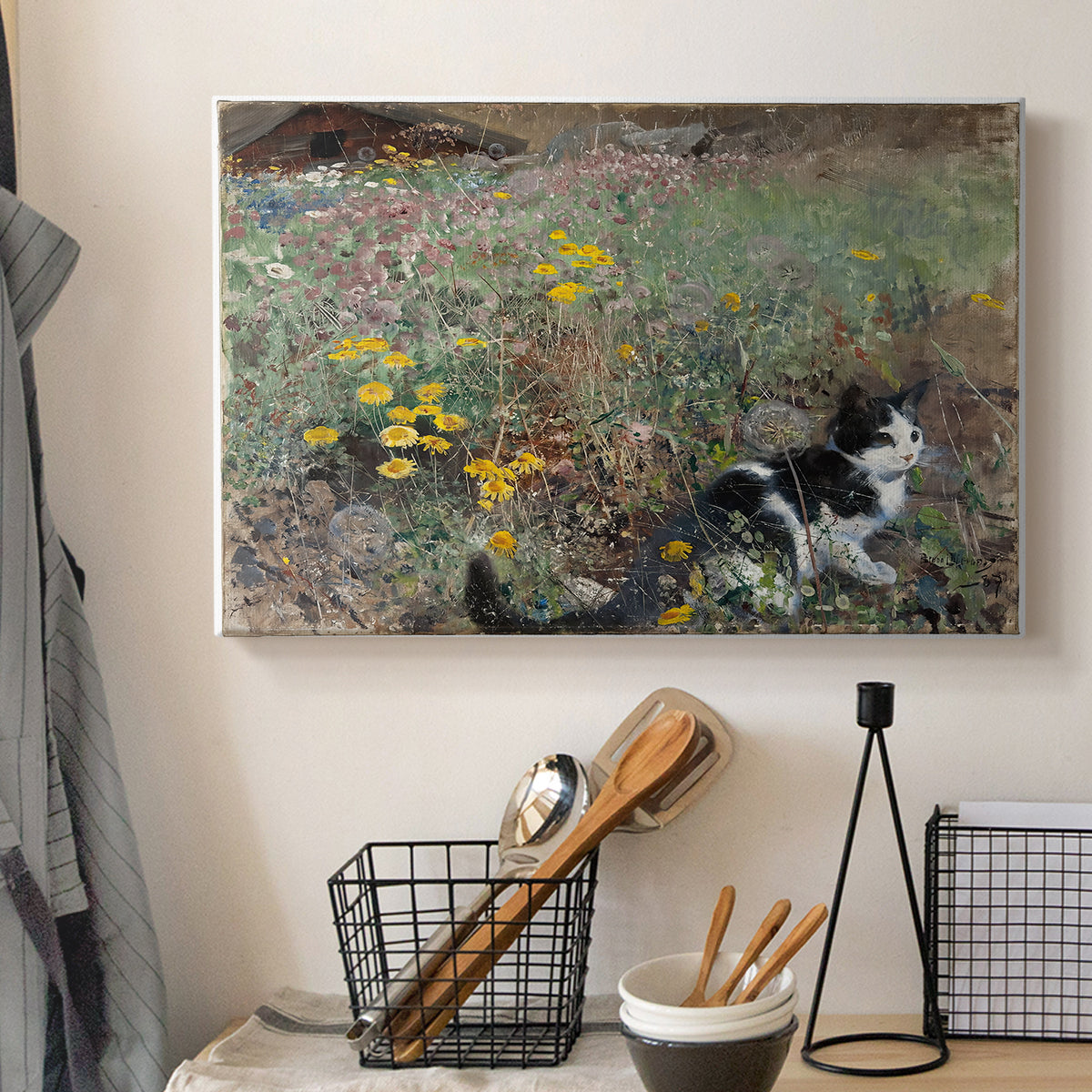 Canvas art print detailing a naturalistic depiction of cat in blooming countryside setting, displayed in a softly lit workspace setting