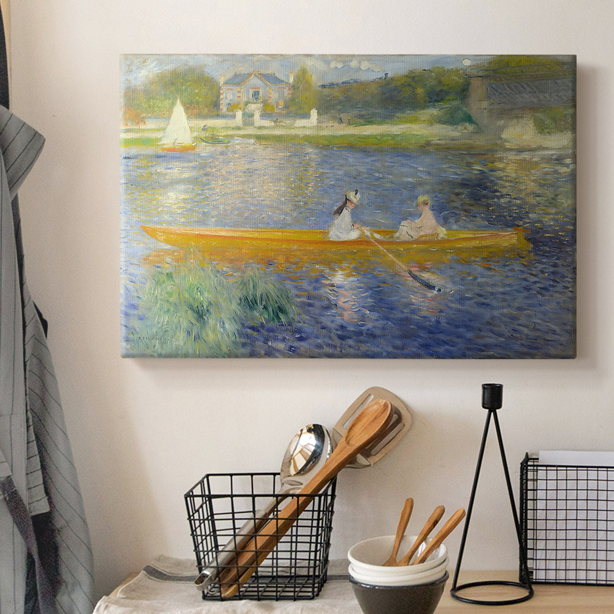 Canvas art print detailing a leisure scene of figures in a small rowboat on tranquil water, displayed in a softly lit workspace setting