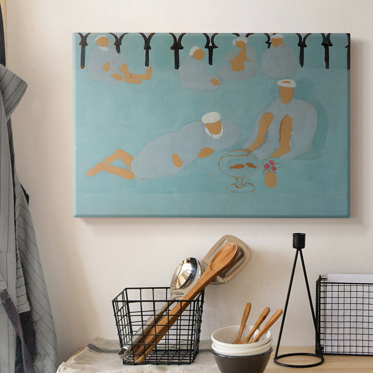 Canvas art print detailing a stylized scene of social gathering with bold color use, displayed in a softly lit workspace setting