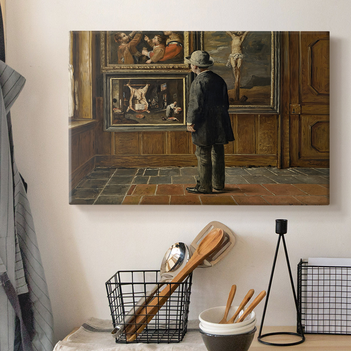 Canvas art print detailing a contemplative moment with figure in art-filled space, displayed in a softly lit workspace setting