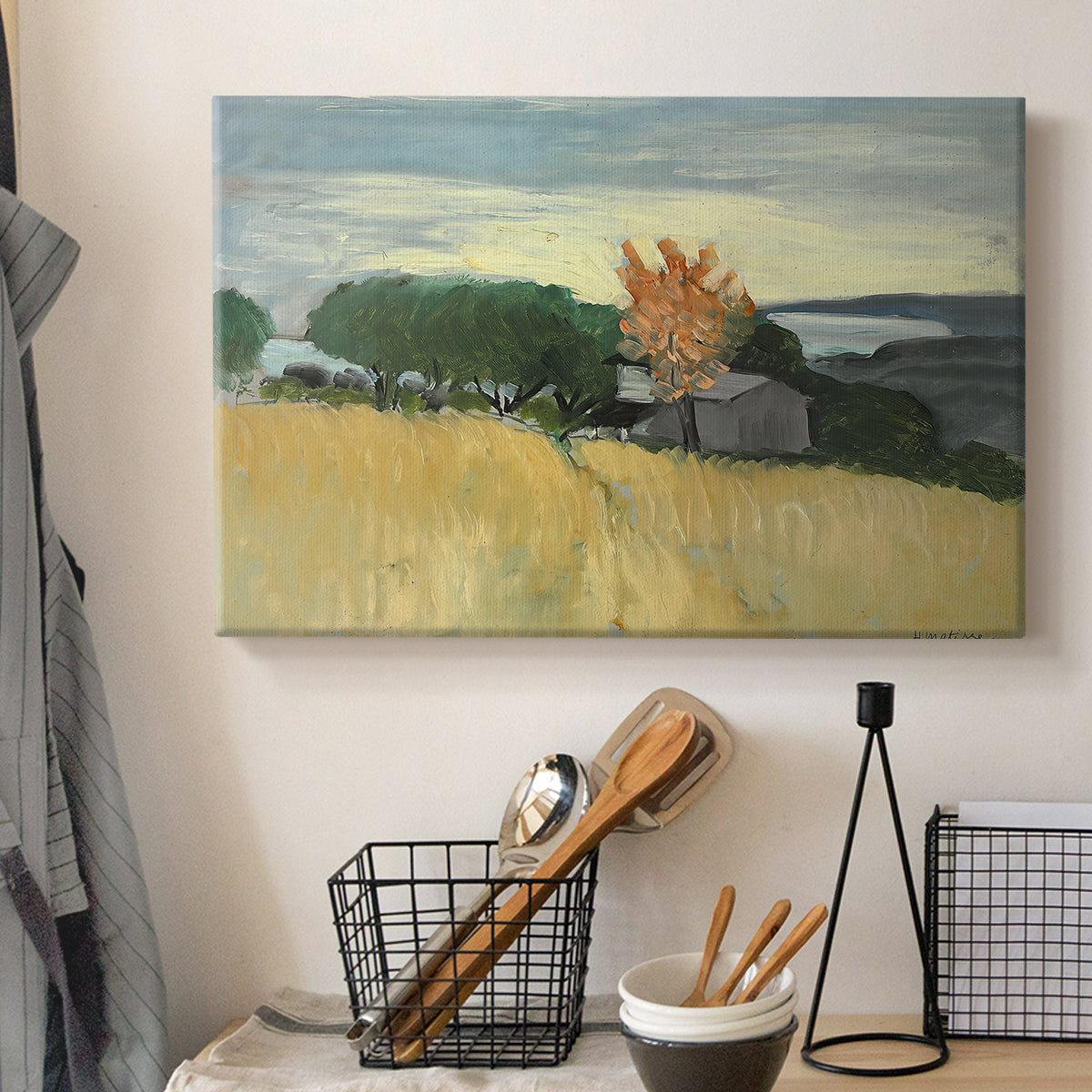 Canvas art print detailing a landscape of ripened wheat in an open natural setting, displayed in a softly lit workspace setting