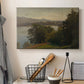 Canvas art print detailing a wide composition with water dominating foreground, displayed in a softly lit workspace setting