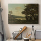Canvas art print detailing a tranquil countryside view with soft atmospheric tones, displayed in a softly lit workspace setting
