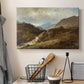 Canvas art print detailing a romantic depiction of mountainous environment, displayed in a softly lit workspace setting