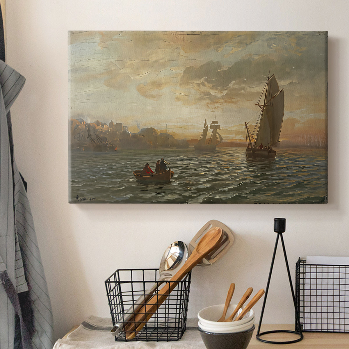 Canvas art print detailing a fjord landscape featuring water, boats, and distant hills, displayed in a softly lit workspace setting