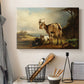 Canvas art print detailing realistic goats in field, displayed in a softly lit workspace setting