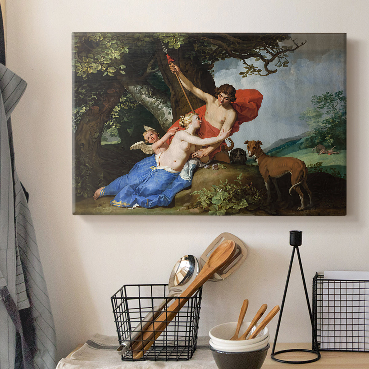 Canvas art print detailing a Baroque painting of nude figures Venus and Adonis with Cupid in forest, displayed in a softly lit workspace setting