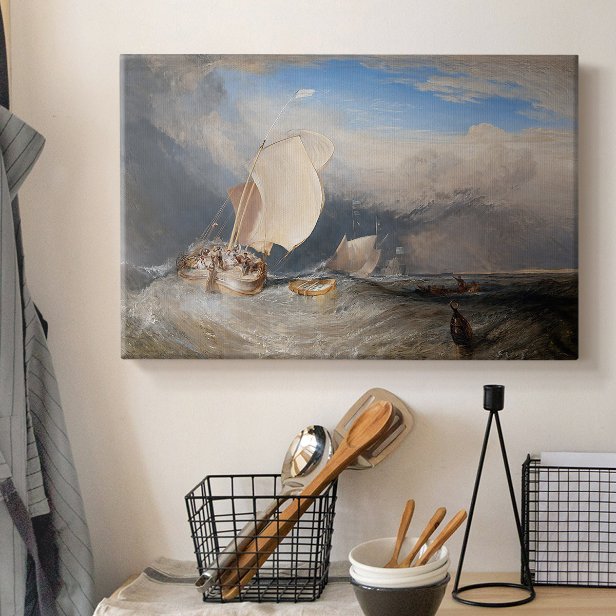 Canvas art print detailing a seaside view featuring boats, figures, and trade, displayed in a softly lit workspace setting