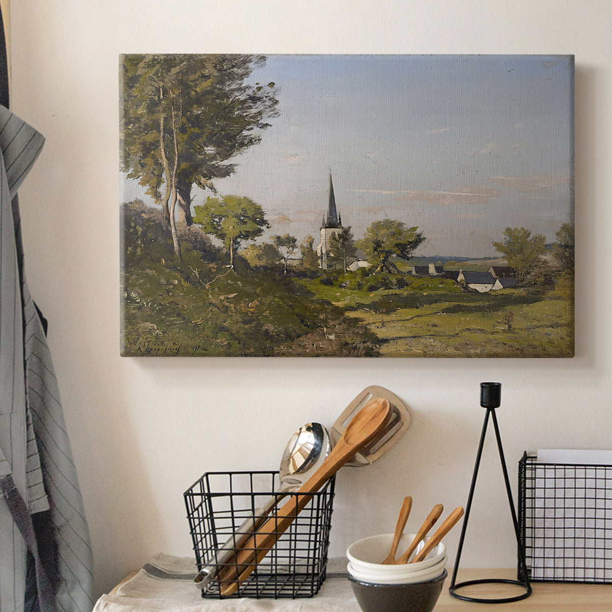 Canvas art print detailing a pastoral view with church structure in natural setting, displayed in a softly lit workspace setting