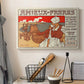 Canvas art print detailing a decorative commercial poster with figures and text in Art Nouveau style, displayed in a softly lit workspace setting