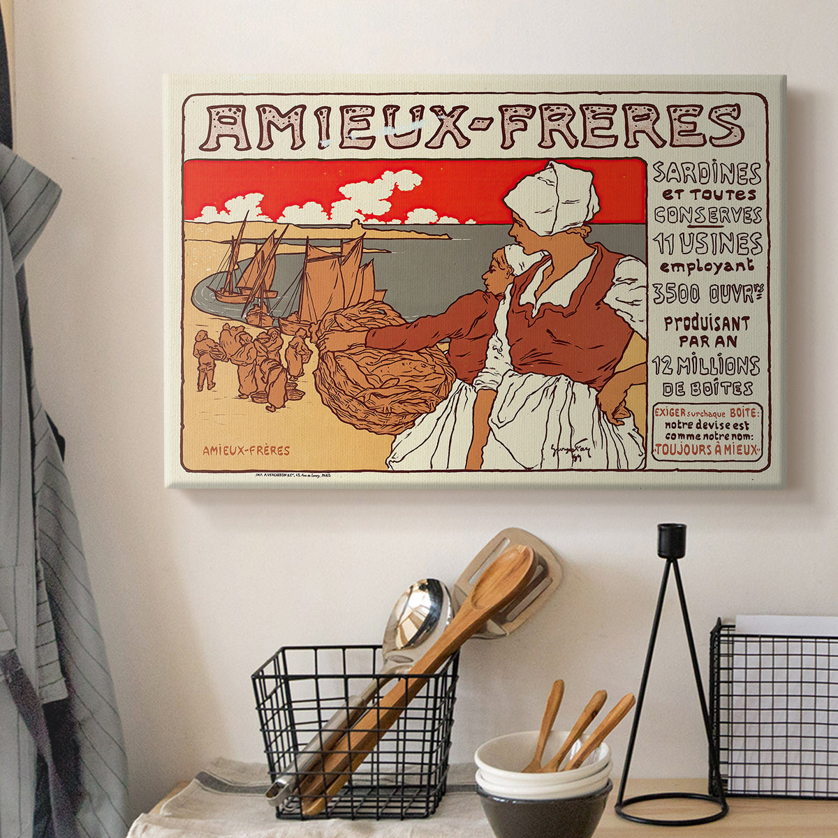 Canvas art print detailing a decorative commercial poster with figures and text in Art Nouveau style, displayed in a softly lit workspace setting