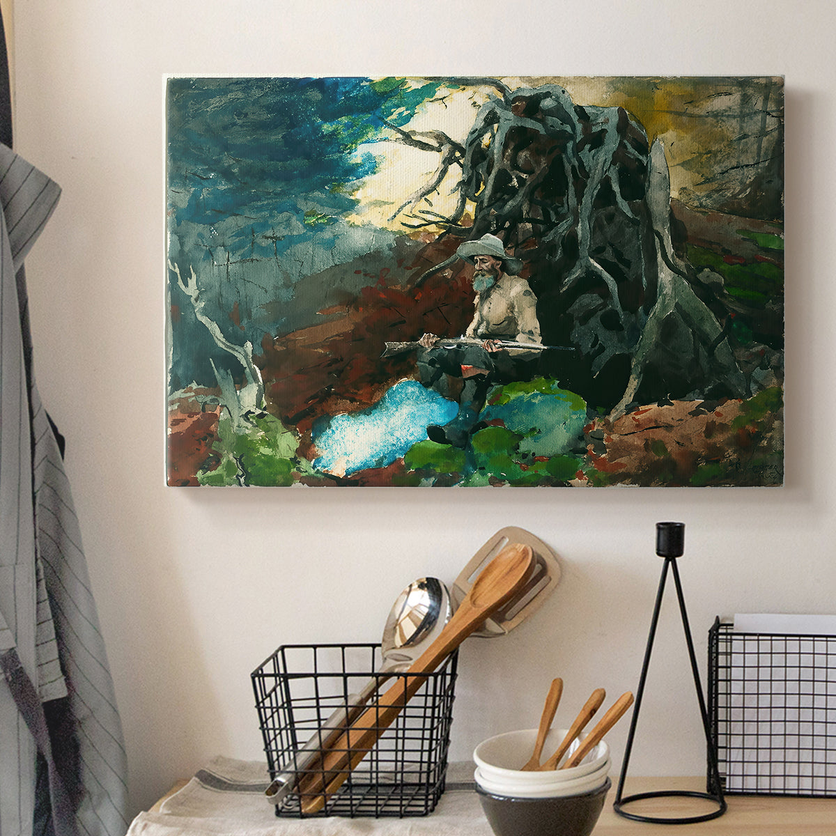 Canvas art print detailing a rustic setting with figure and firelight among trees, displayed in a softly lit workspace setting