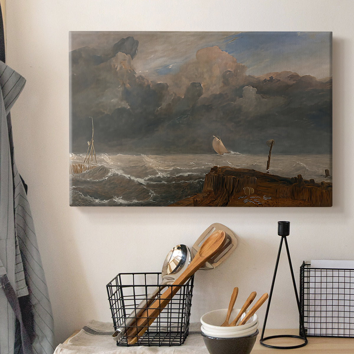 Canvas art print detailing a seaside composition with harbor, displayed in a softly lit workspace setting