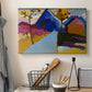 Canvas art print detailing a stylized street perspective with geometric simplification, displayed in a softly lit workspace setting