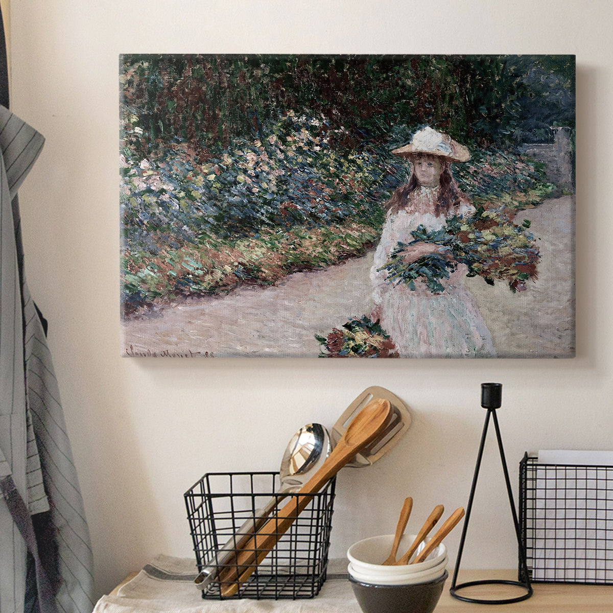 Canvas art print detailing a tranquil outdoor portrait of girl in floral setting, displayed in a softly lit workspace setting