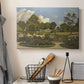 Canvas art print detailing a pastoral garden view with soft light and open space, displayed in a softly lit workspace setting