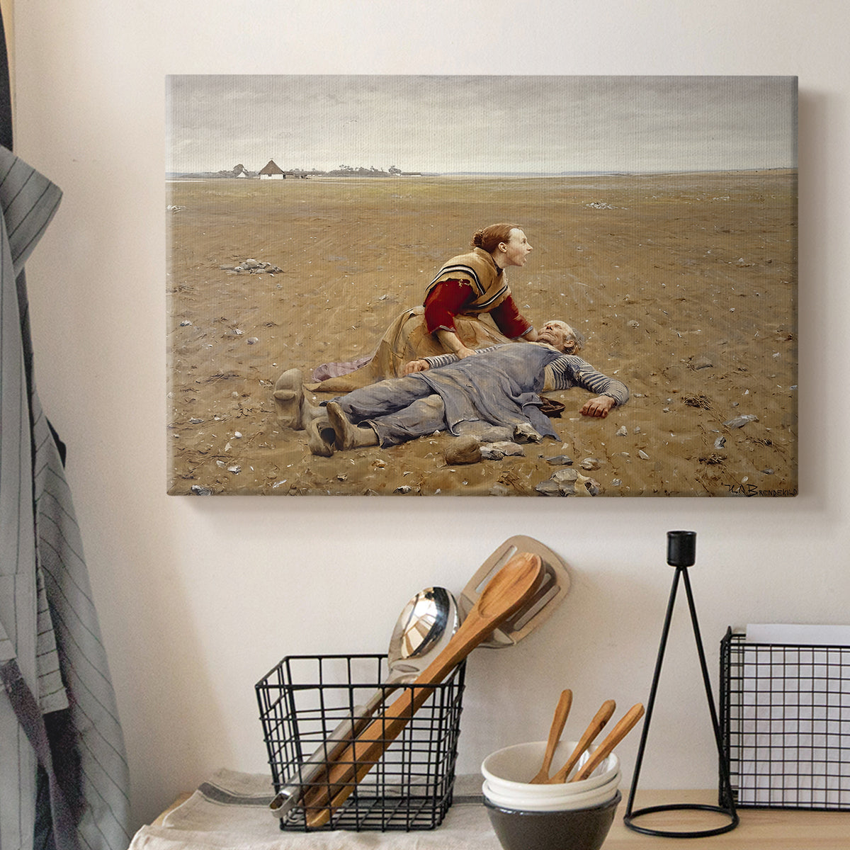 Canvas art print detailing a solitary figure collapsed in natural setting, displayed in a softly lit workspace setting