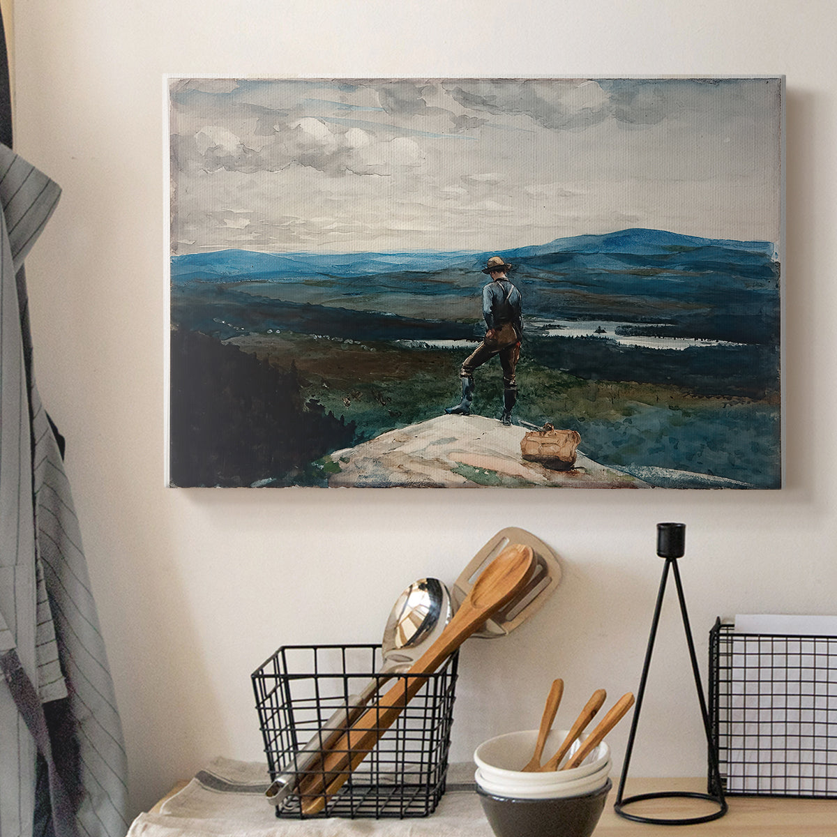 Canvas art print detailing a quiet lake scene with lone person and open horizon, displayed in a softly lit workspace setting