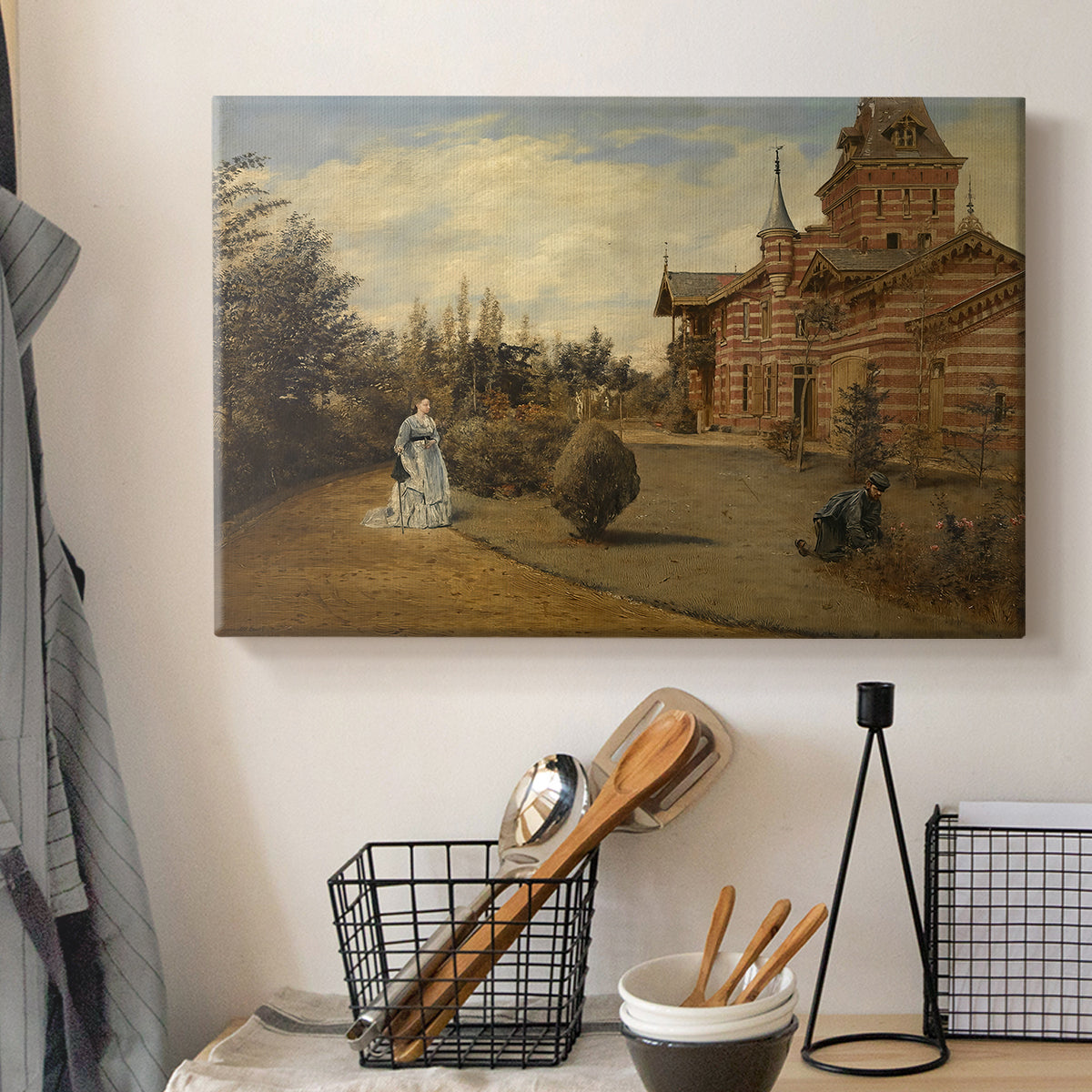 Canvas art print detailing a street view centered on building and surrounding structures, displayed in a softly lit workspace setting