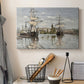 Canvas art print detailing a nautical landscape with vessels resting on calm water, displayed in a softly lit workspace setting