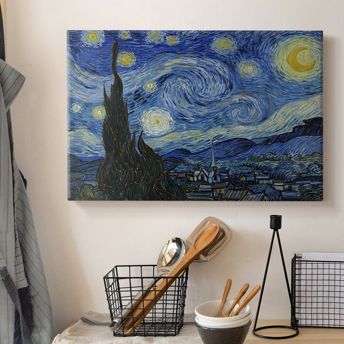 Canvas art print detailing an iconic landscape featuring cypress and luminous stars, displayed in a softly lit workspace setting