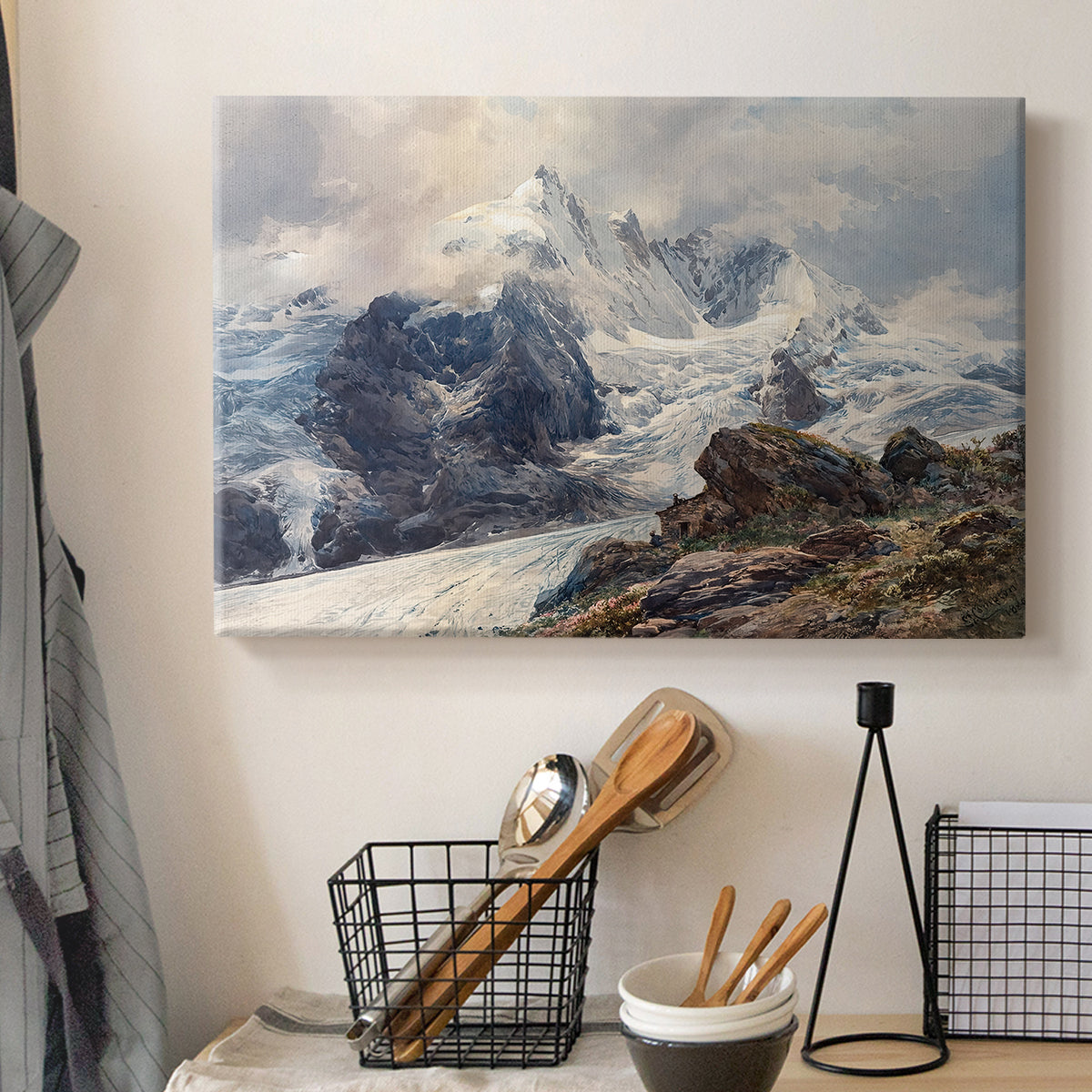 Canvas art print detailing an alpine peak dominating surrounding terrain, displayed in a softly lit workspace setting
