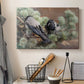 Canvas art print detailing a wildlife painting of dark birds against muted landscape, displayed in a softly lit workspace setting