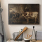 Canvas art print detailing a pastoral scene with two oxen in field, displayed in a softly lit workspace setting