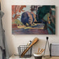 Canvas art print detailing a colorful landscape view of a garden, displayed in a softly lit workspace setting