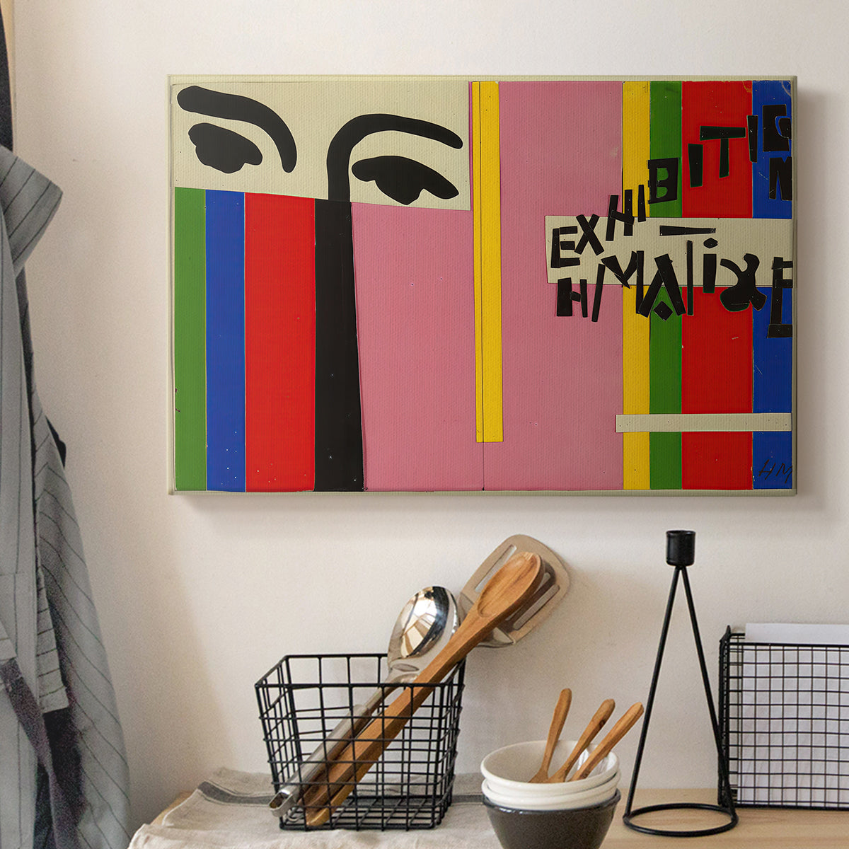 Canvas art print detailing a stylized cover artwork with strong visual contrast, displayed in a softly lit workspace setting