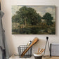 Canvas art print detailing a tranquil forest setting with atmospheric light, displayed in a softly lit workspace setting
